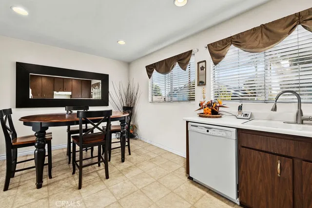 a kitchen with stainless steel appliances granite countertop a stove sink and cabinets