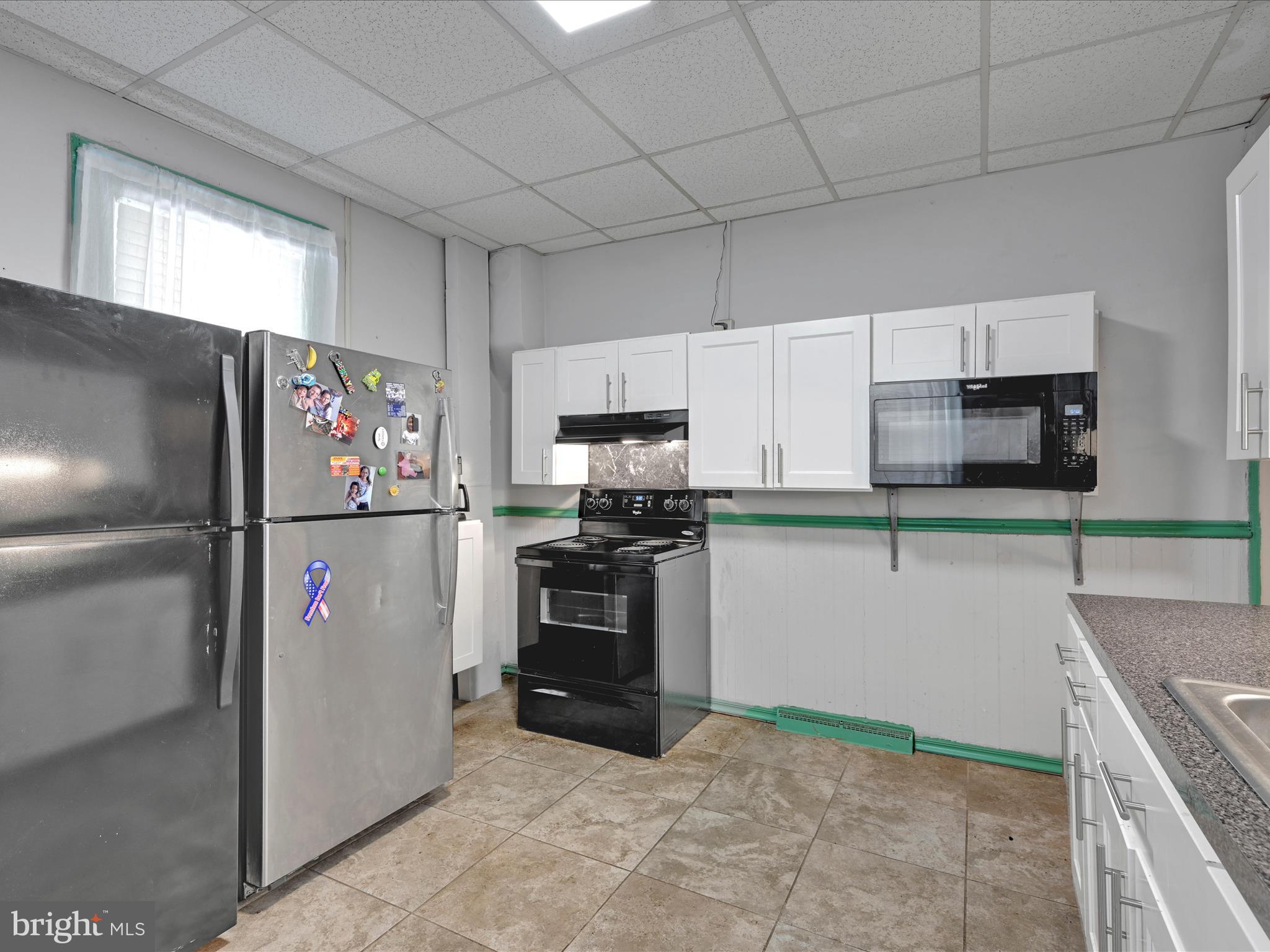 337 South 9th Street Lebanon, PA 17042 - Photo 13 of 26 a kitchen with stainless steel appliances granite countertop a refrigerator and a stove