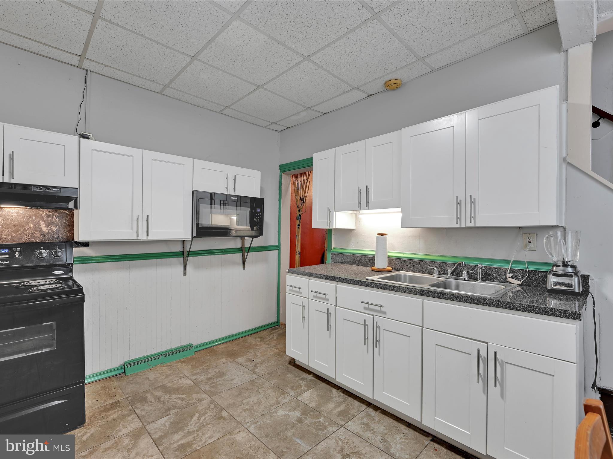 337 South 9th Street Lebanon, PA 17042 - Photo 10 of 26 a kitchen with granite countertop white cabinets and white appliances