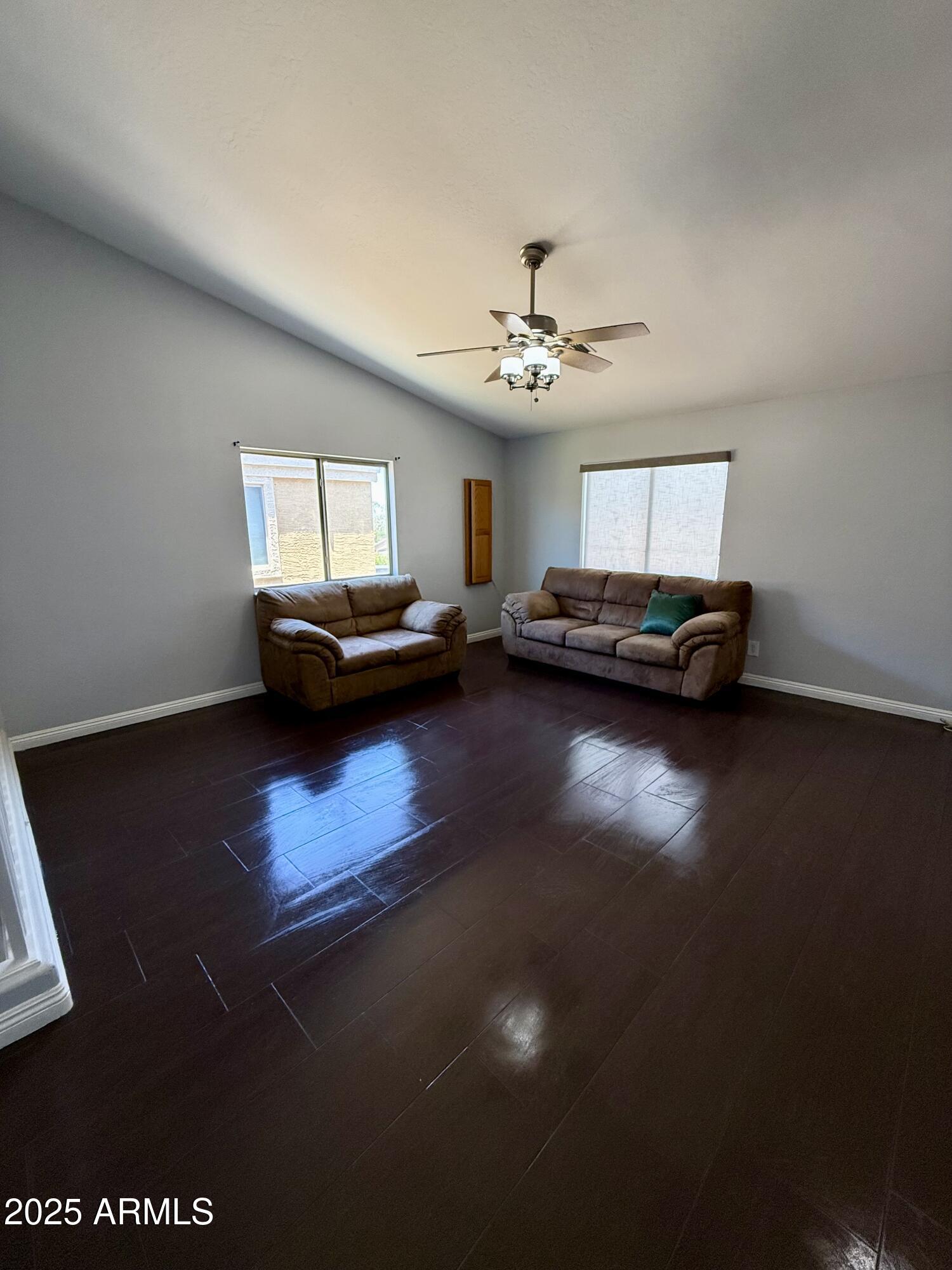 8534 West Cordes Road Tolleson, AZ 85353 - Photo 13 of 22 a living room with furniture and a wooden floor