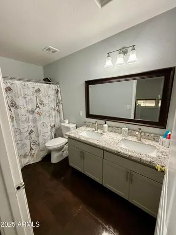 a view of a room with wooden floor and window