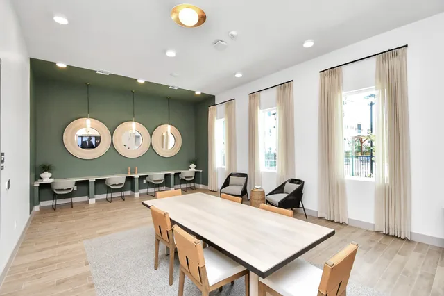 a living room with kitchen island furniture and a large window