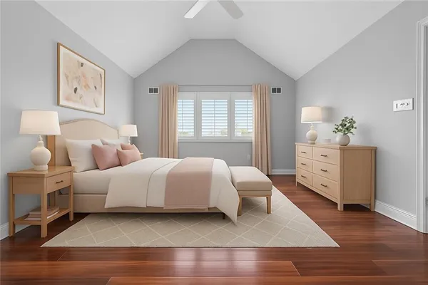 a spacious bedroom with a bed and a couch