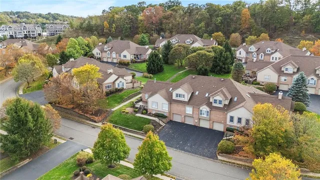 an aerial view of a house with a garden