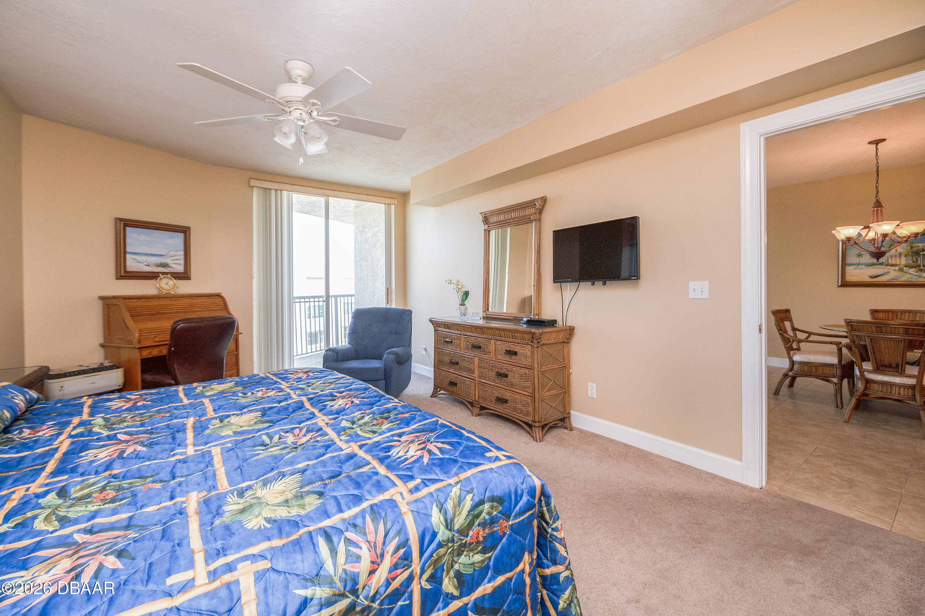 4575 South Atlantic Avenue, Unit 6701 Ponce Inlet, FL 32127 - Photo 17 of 35 a bedroom with a bed and furniture