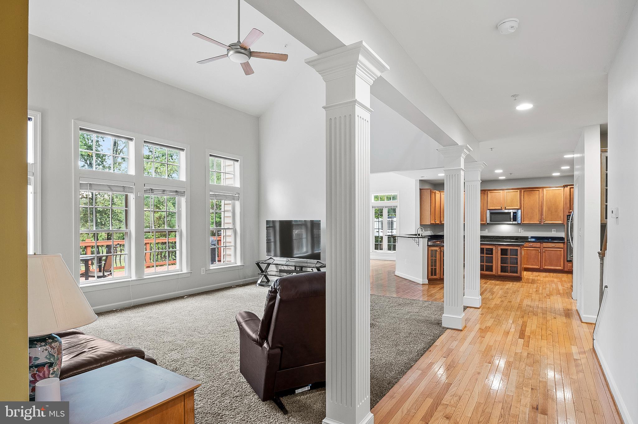 12912 Bay Hill Drive Beltsville, MD 20705 - Photo 10 of 60 a living room with furniture and a floor to ceiling window