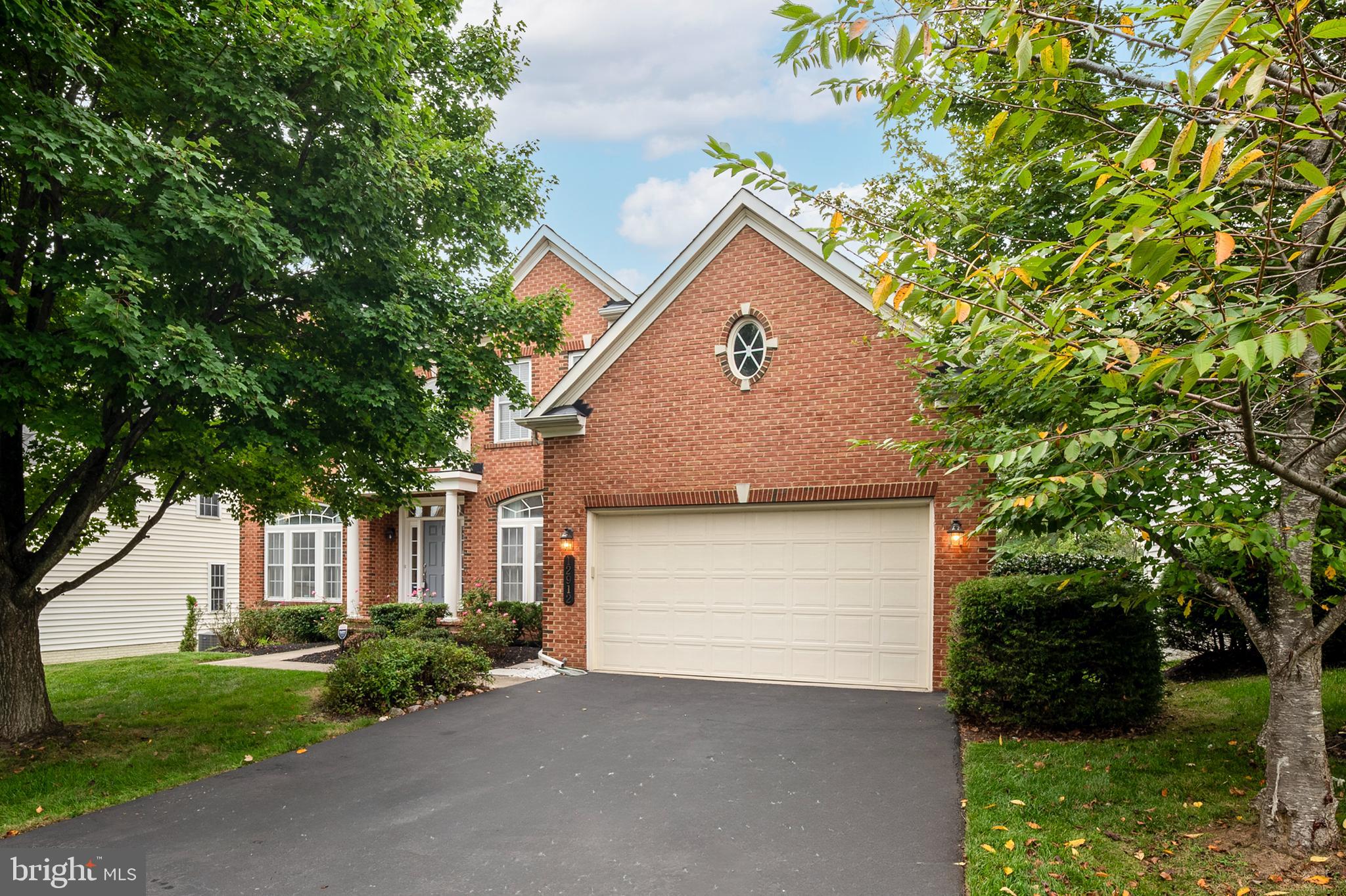 12912 Bay Hill Drive Beltsville, MD 20705 - Photo 2 of 60 a front view of a house with a yard and garage
