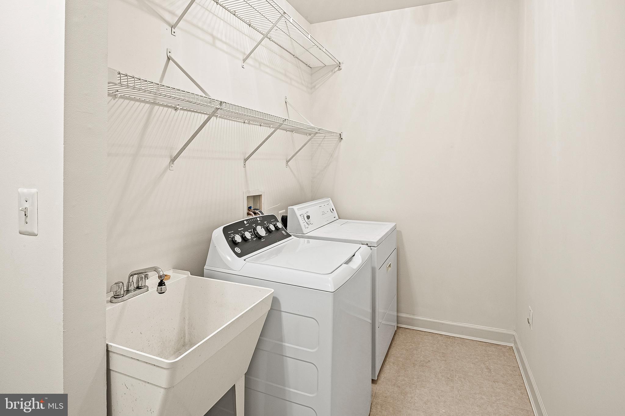 12912 Bay Hill Drive Beltsville, MD 20705 - Photo 21 of 60 a utility room with dryer and washer