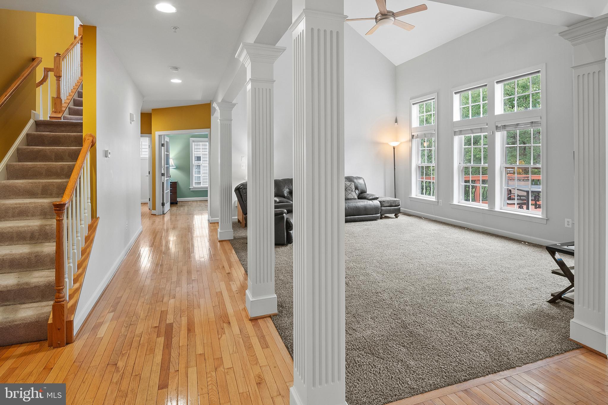 12912 Bay Hill Drive Beltsville, MD 20705 - Photo 22 of 60 a view of a hallway with wooden floor and staircase