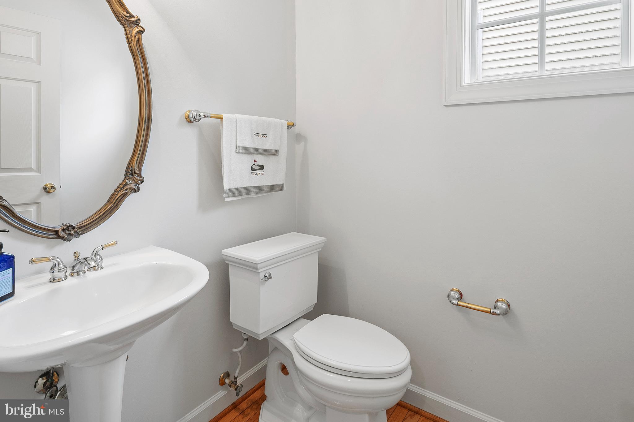 12912 Bay Hill Drive Beltsville, MD 20705 - Photo 24 of 60 a bathroom with a sink mirror and toilet