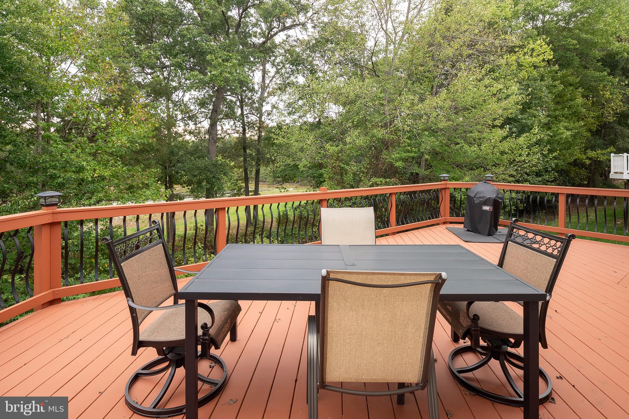 12912 Bay Hill Drive Beltsville, MD 20705 - Photo 44 of 60 a view of a chairs and table on the deck