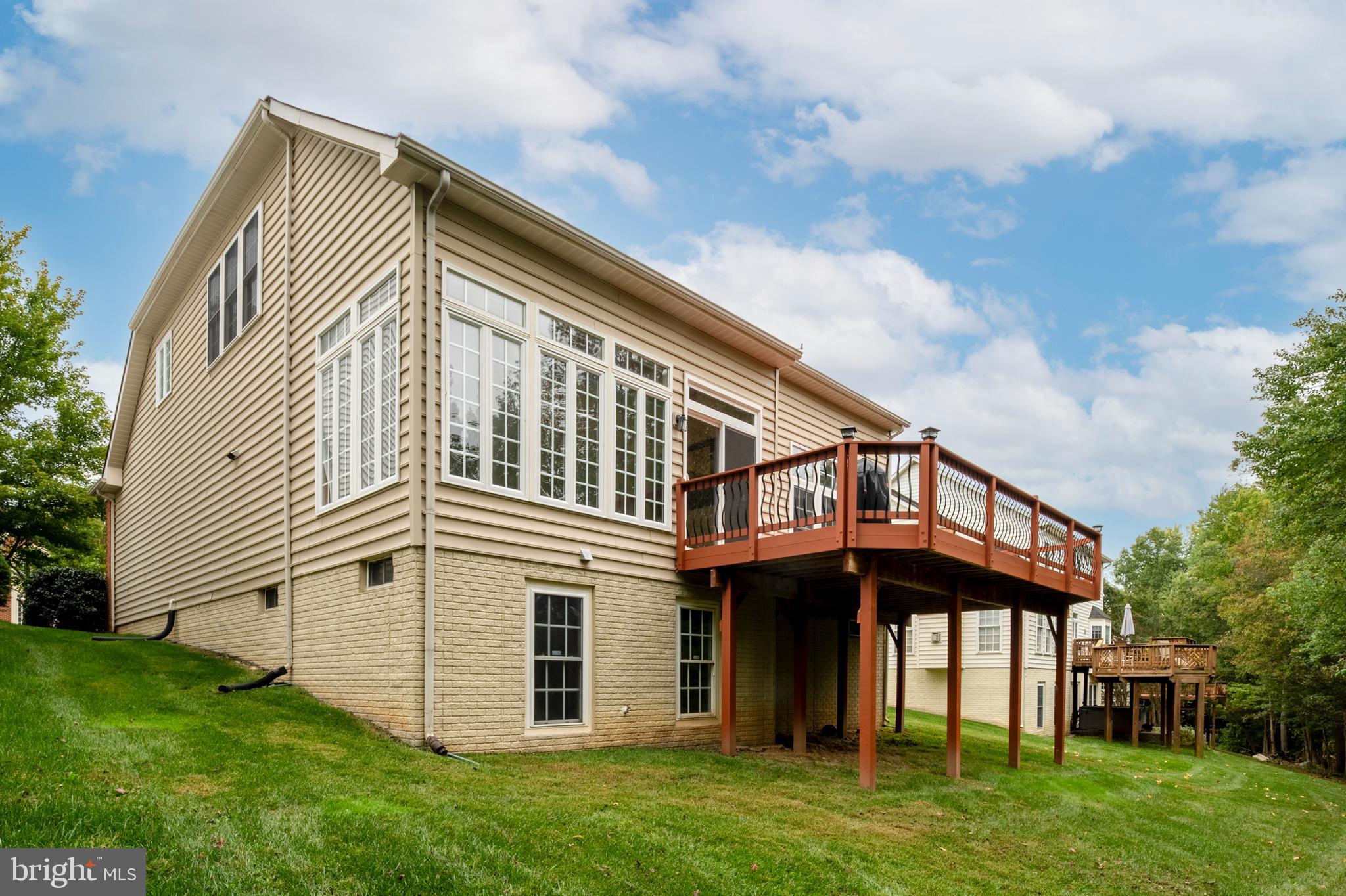 12912 Bay Hill Drive Beltsville, MD 20705 - Photo 50 of 60 a front view of a house with a garden