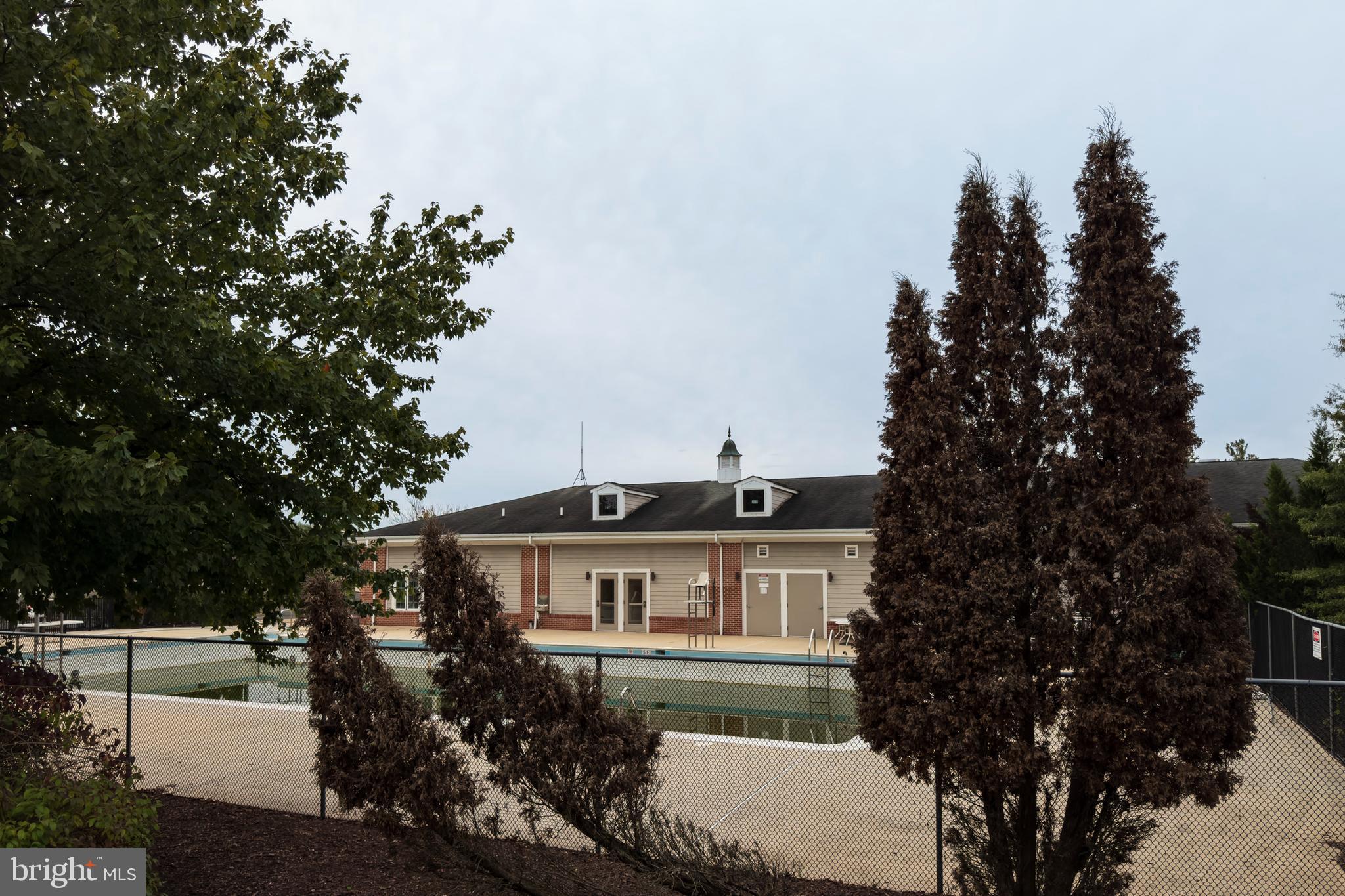 12912 Bay Hill Drive Beltsville, MD 20705 - Photo 54 of 60 a view of a house with a yard and potted plants