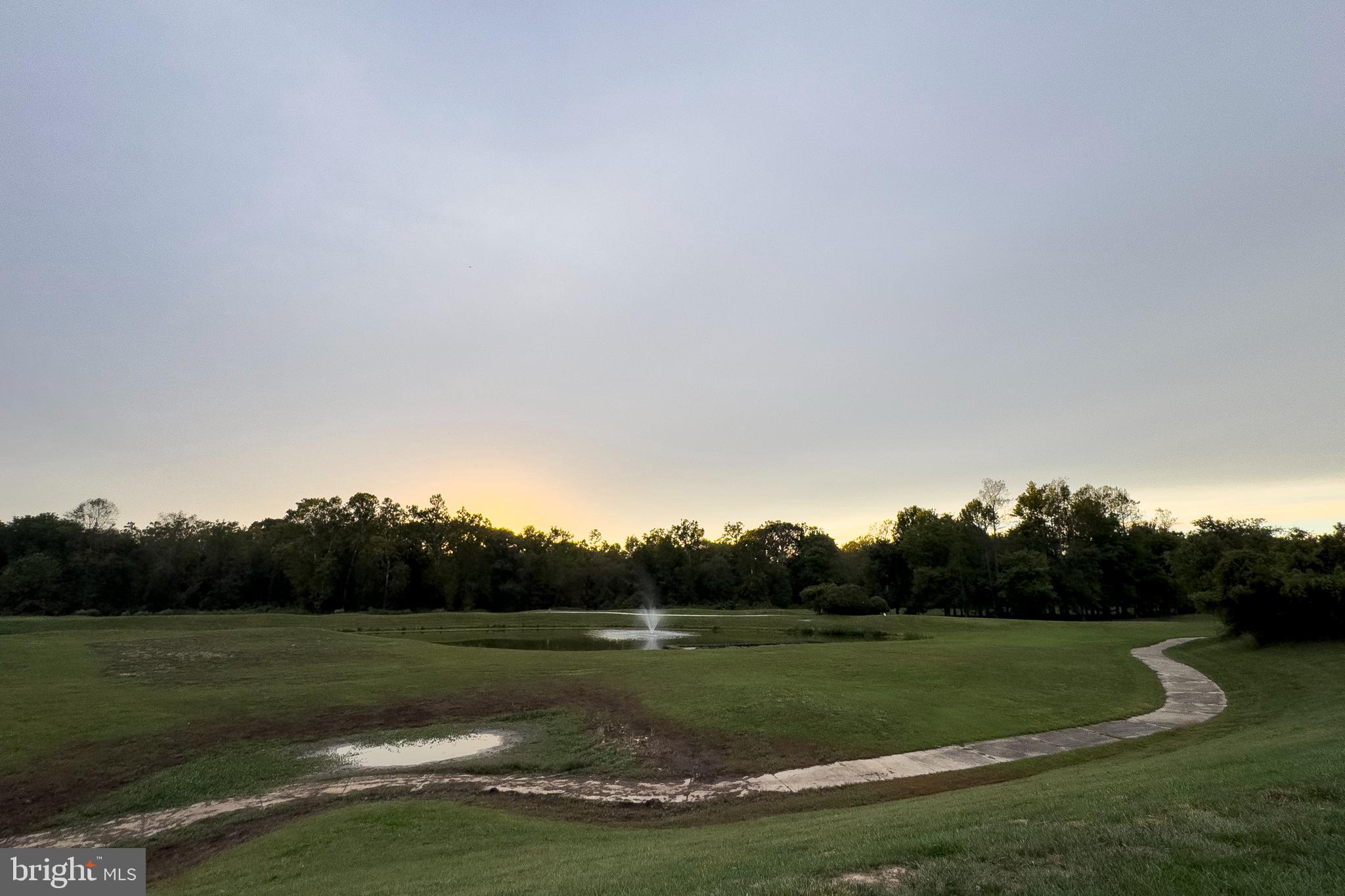 12912 Bay Hill Drive Beltsville, MD 20705 - Photo 55 of 60 a view of a grassy field with trees