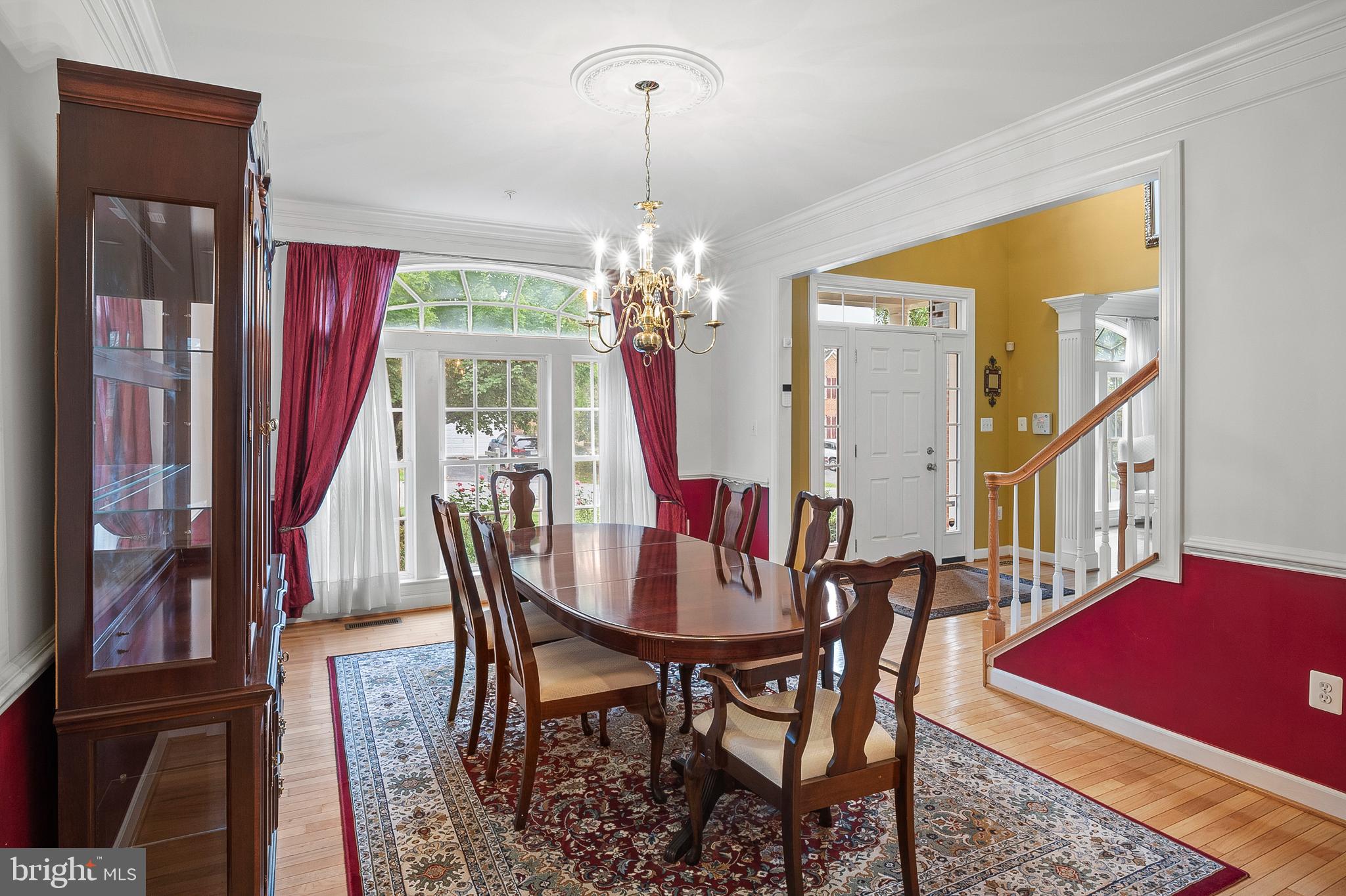 12912 Bay Hill Drive Beltsville, MD 20705 - Photo 7 of 60 a view of a dining room with furniture and a chandelier