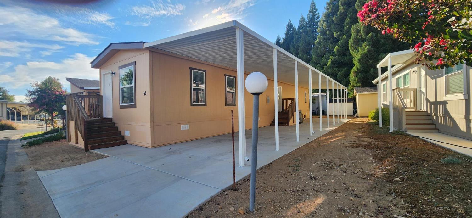 350 Pleasant Valley Road, Unit 56 Diamond Springs, CA 95619 - Photo 1 of 15 a view of a house with a backyard