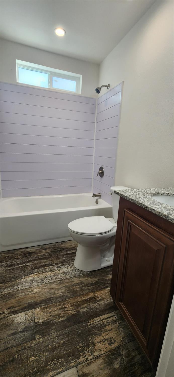 350 Pleasant Valley Road, Unit 56 Diamond Springs, CA 95619 - Photo 7 of 15 a bathroom with a sink toilet and shower