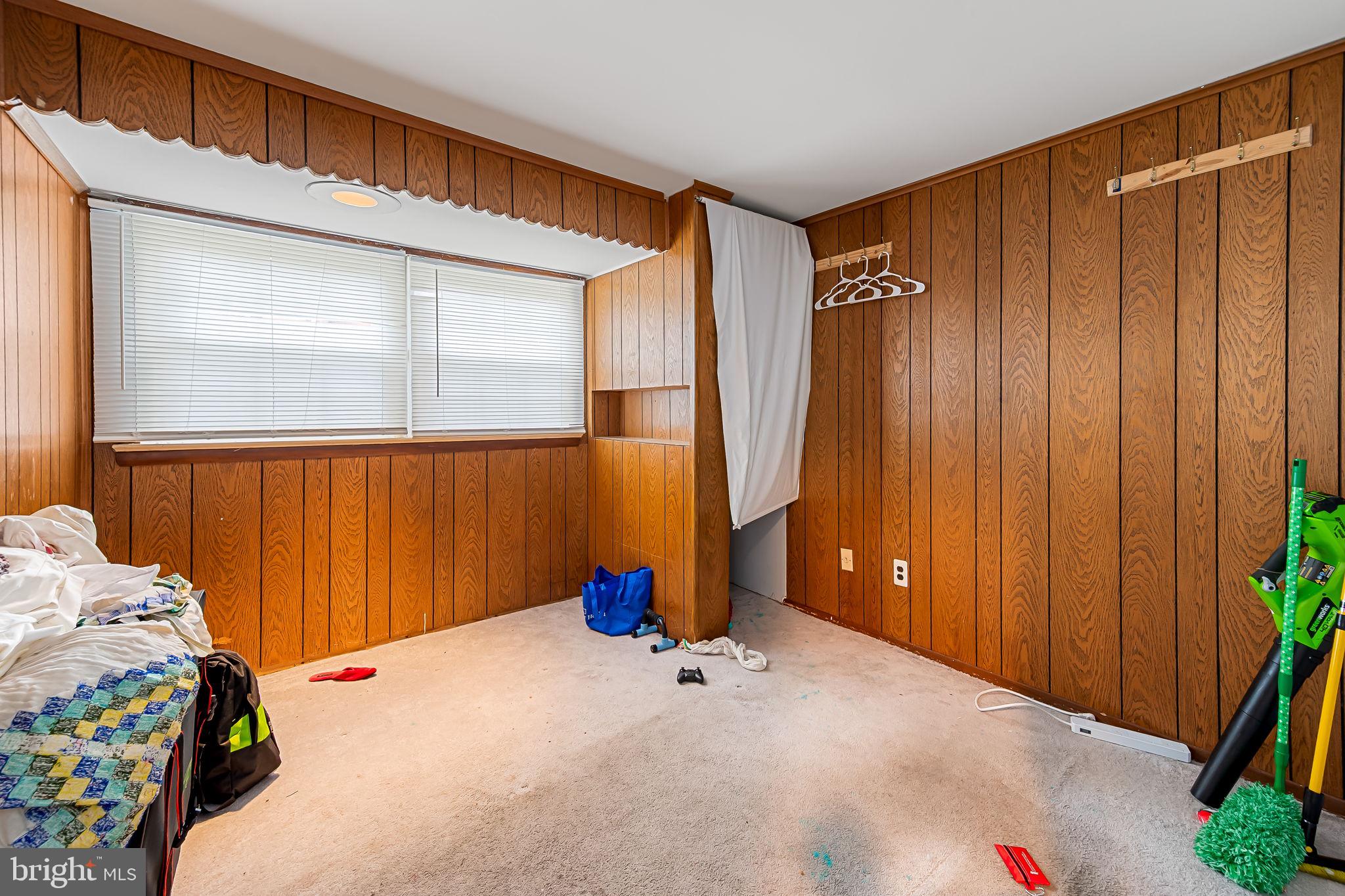 1202 Dunoon Court Silver Spring, MD 20903 - Photo 11 of 23 a bedroom with a bed and a window