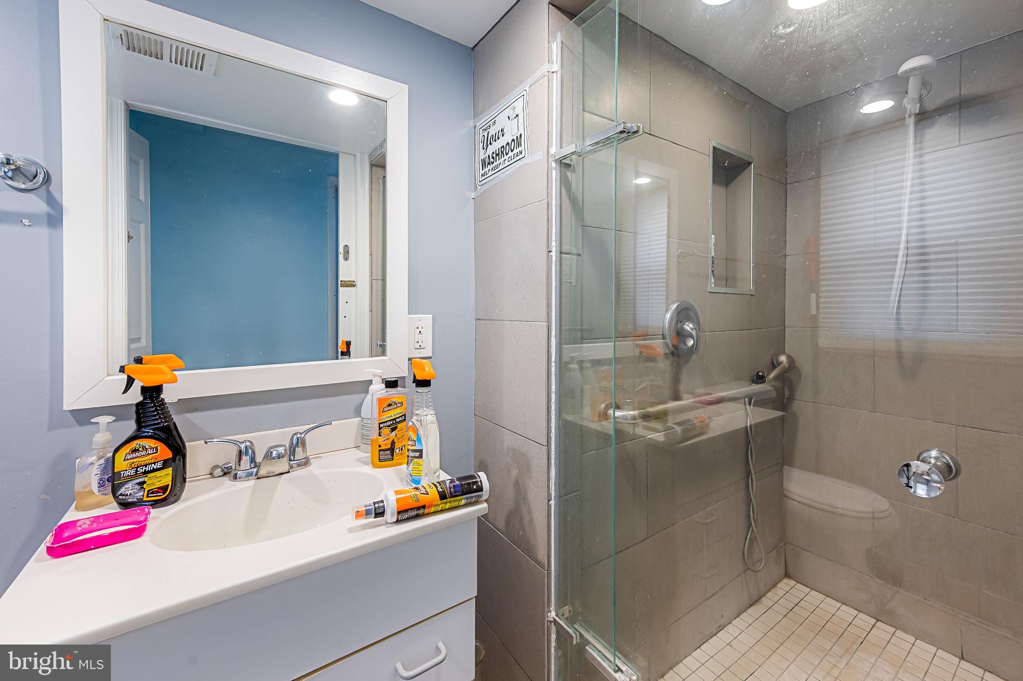 1202 Dunoon Court Silver Spring, MD 20903 - Photo 13 of 23 a bathroom with a sink and mirror