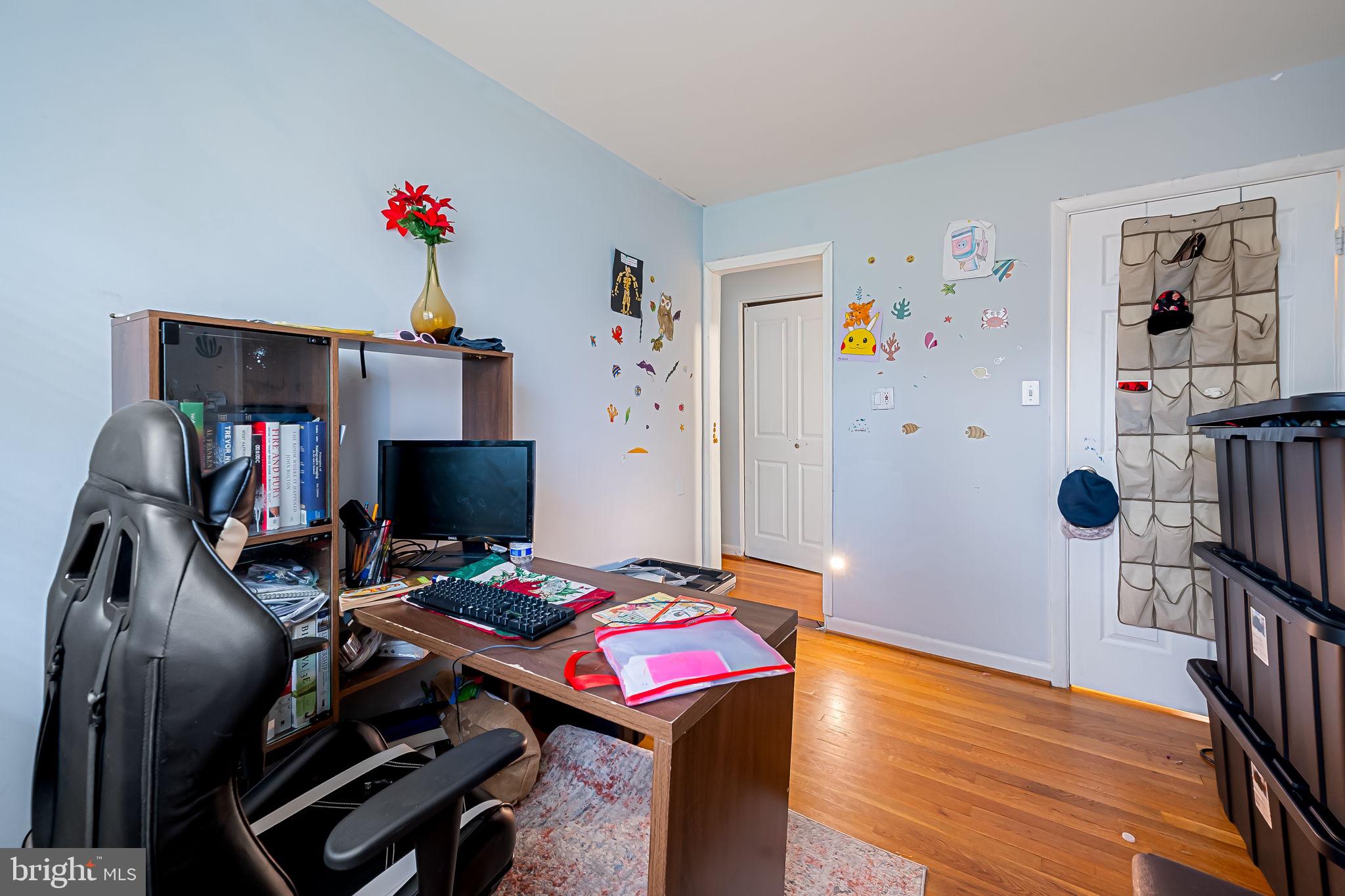 1202 Dunoon Court Silver Spring, MD 20903 - Photo 15 of 23 a living room with furniture and a flat screen tv