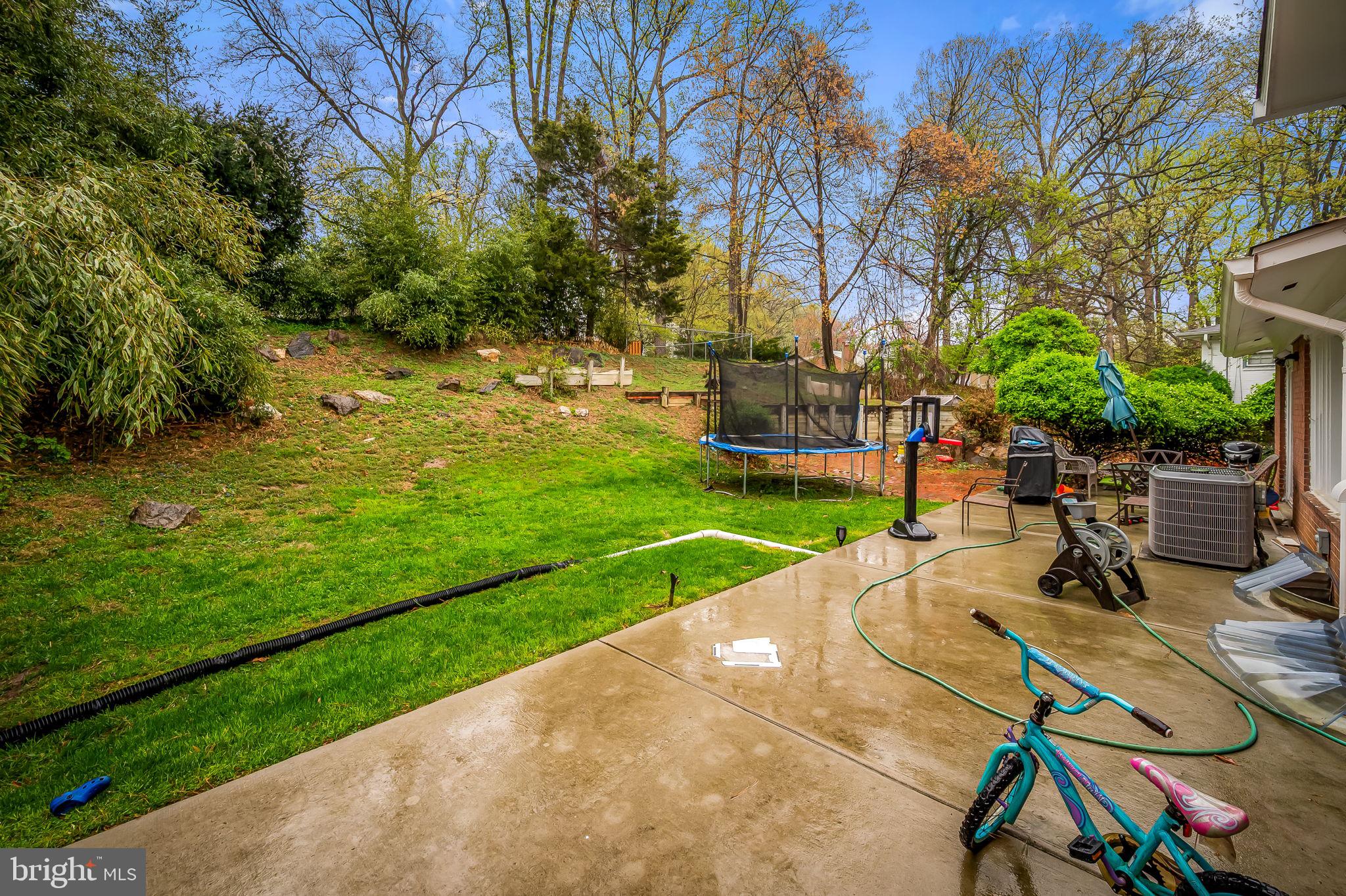 1202 Dunoon Court Silver Spring, MD 20903 - Photo 20 of 23 a view of a backyard with a patio