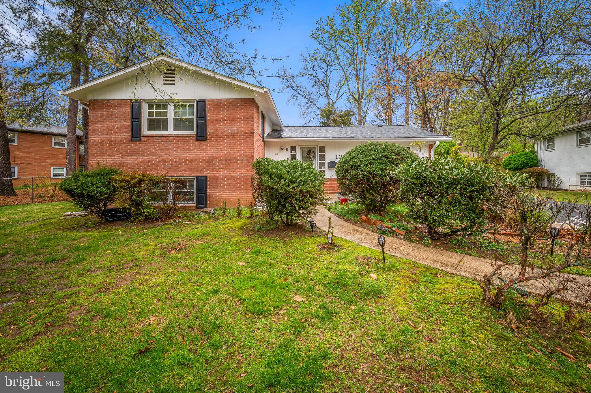 1202 Dunoon Court Silver Spring, MD 20903 - Photo 2 of 23 a front view of a house with a yard