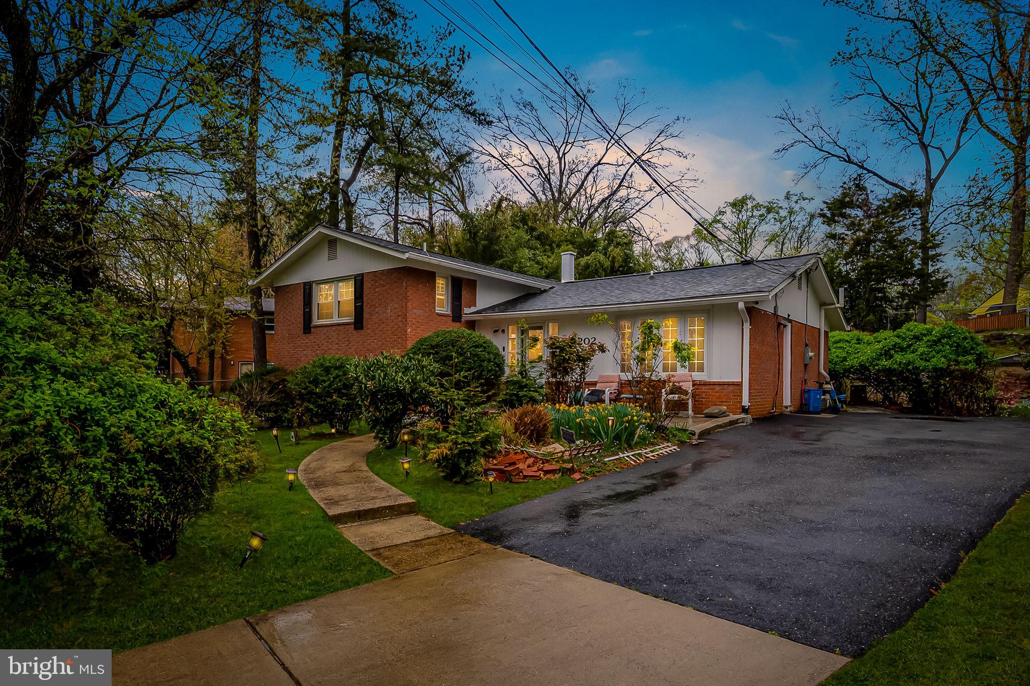 1202 Dunoon Court Silver Spring, MD 20903 - Photo 4 of 23 a view of a house with garden and plants