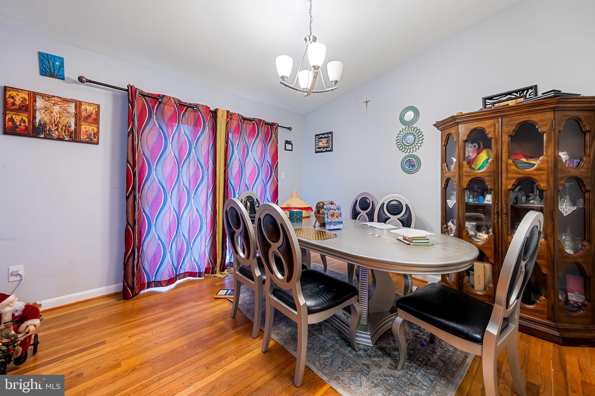 1202 Dunoon Court Silver Spring, MD 20903 - Photo 6 of 23 a view of a dining room with furniture and chandelier