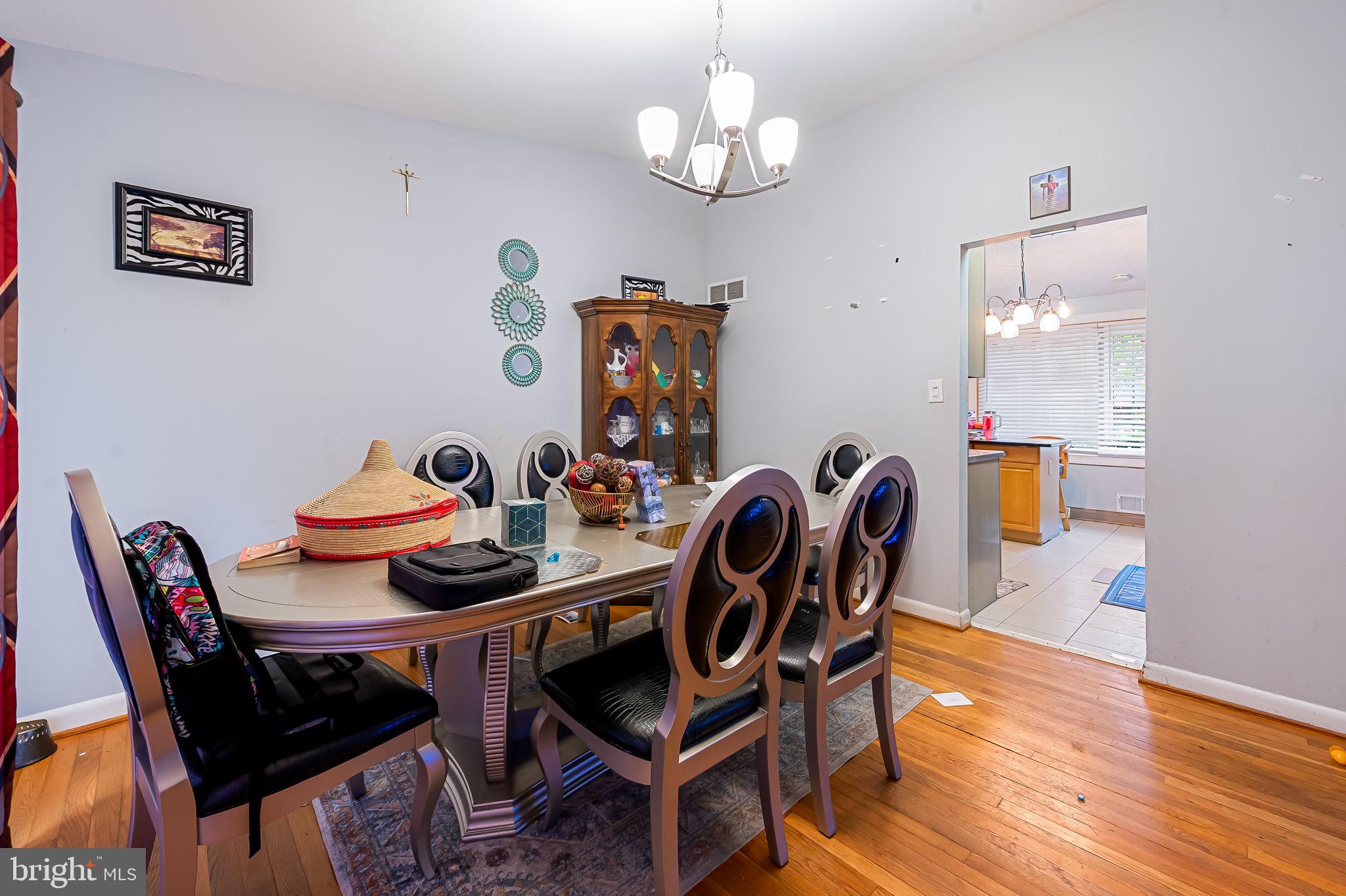 1202 Dunoon Court Silver Spring, MD 20903 - Photo 7 of 23 a view of a dining room with furniture and wooden floor