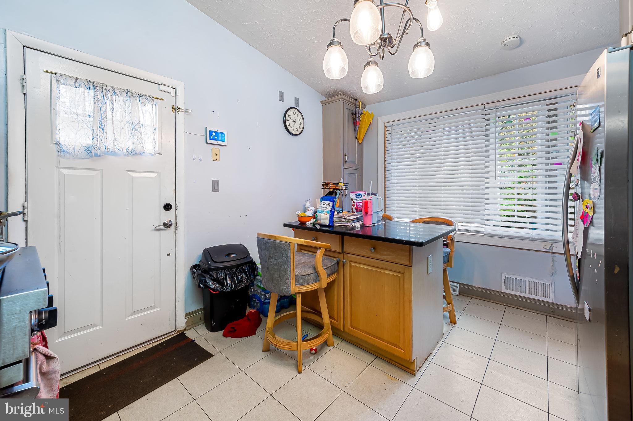 1202 Dunoon Court Silver Spring, MD 20903 - Photo 9 of 23 a view of a workspace with furniture and a window