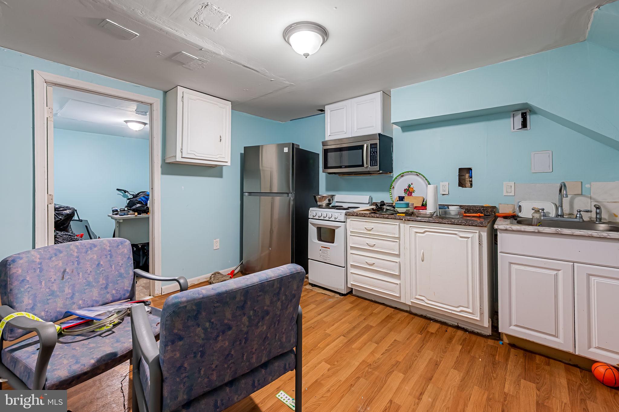 1202 Dunoon Court Silver Spring, MD 20903 - Photo 10 of 23 a kitchen with stainless steel appliances a refrigerator and a stove top oven