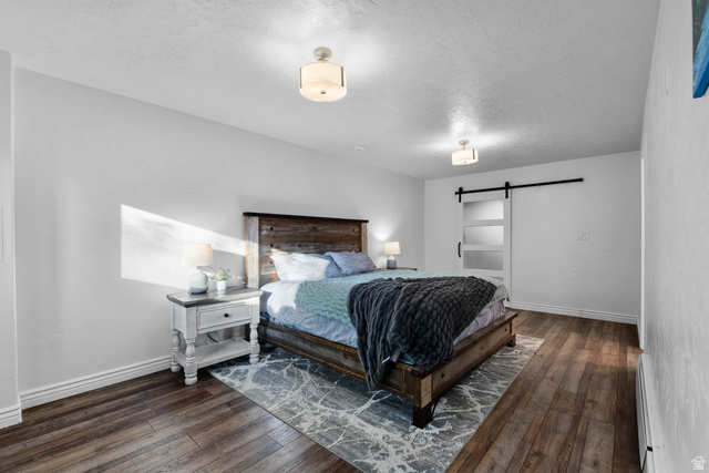 10686 South Covered Brg Cyn Road, Unit 14 Spanish Fork, UT 84660 - Photo 42 of 44 Bedroom with wood-finish flooring and white baseboards
