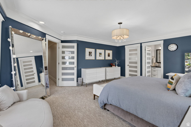 12308 Mariah Circle Draper, UT 84020 - Photo 78 of 293 Spacious bedroom featuring blue accent walls, crown molding, and light-colored patterned carpeting