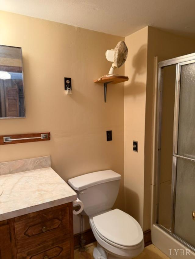 439 Midgett Farm Road Concord, VA 24538 - Photo 22 of 27 a bathroom with a toilet and a shower