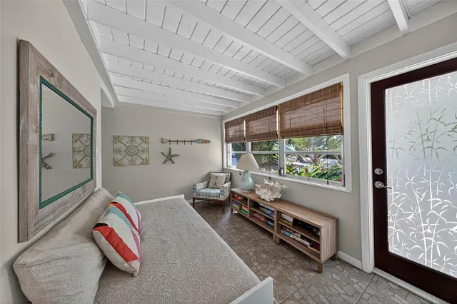 a room with furniture and a large window