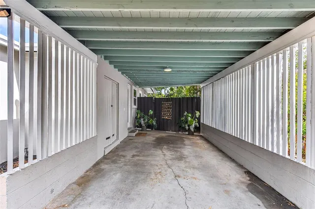 a view of backyard with wooden stairs