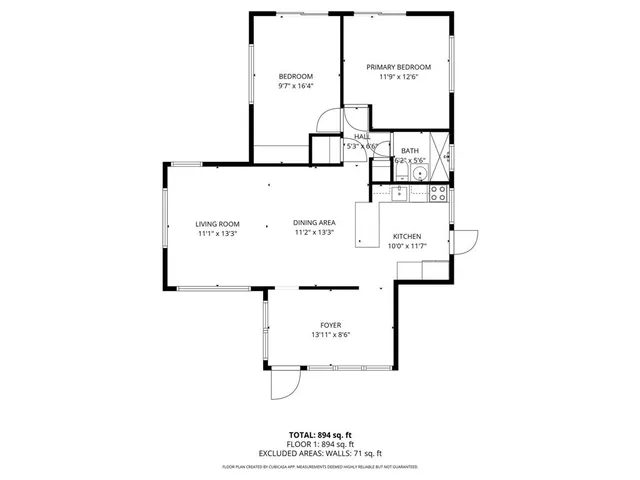 a picture of a bench in front of a wall