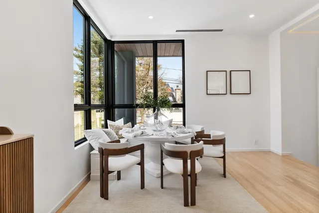 a view of a workspace with furniture and window