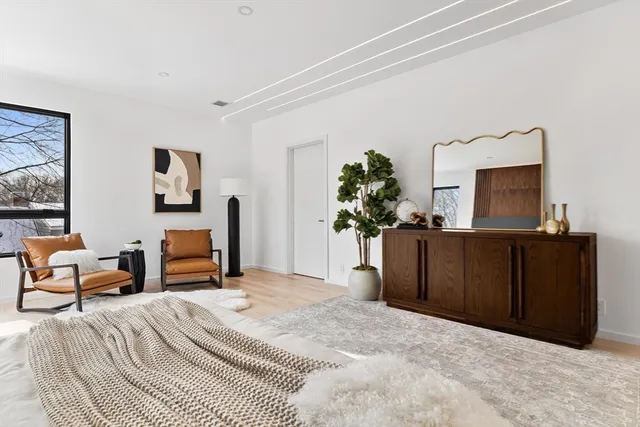 a bedroom with a bed and a dresser