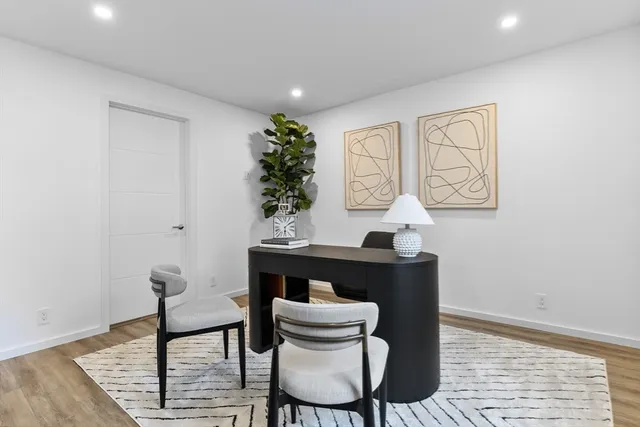 a room with furniture and wooden floor