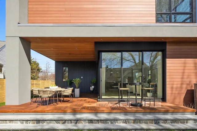 a view of a dining room with a table and chairs