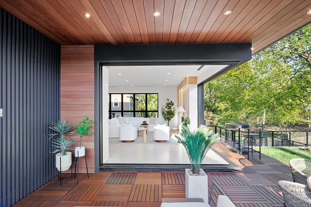 a view of a porch with furniture and garden