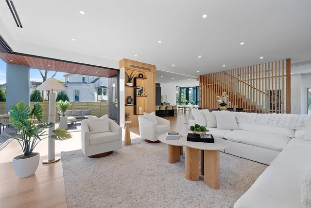 a living room with furniture and white floor