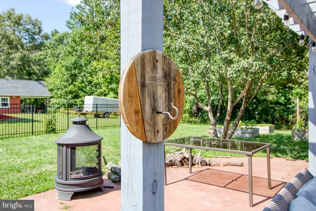 a kitchen with granite countertop a stove sink and cabinets