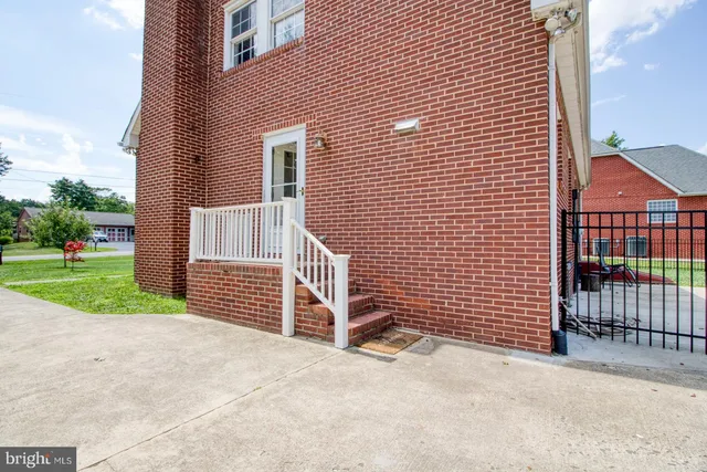 a kitchen with granite countertop a stove and a sink