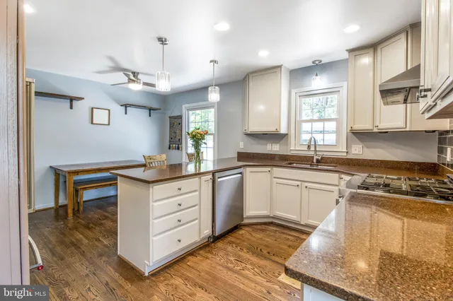 a view of living room with a granite countertop furniture and a potted plant