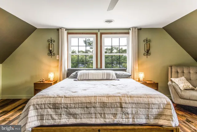a bathroom with a toilet and a window