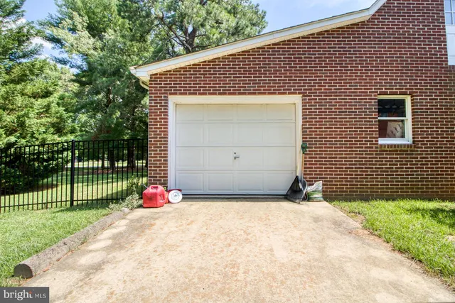 a front view of a house with a fence
