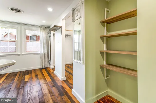 a bedroom with a bed and a cabinets