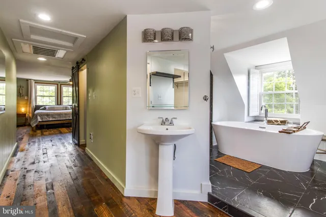 a view of living room kitchen and entryway